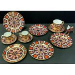 A pair of Royal Crown Derby Imari 1128 pattern coffee cans and saucers, two tea saucers, four side