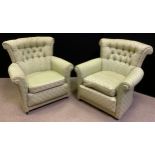 A pair of mid century button-back arm chairs, fan-shaped backs, scroll arms, pale green