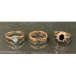 Rings - a diamond and deep blue/black stone cluster ring, 9ct gold shank, size M, 2.2g gross;