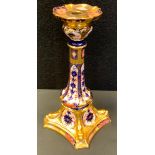 A Royal Crown Derby Imari 1128 pattern Castleton candlestick, dolphins to angles, 27cm high, first