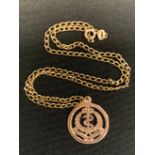 An Army Medical Corp 9ct gold pendant, stamped 9ct, suspended from a later curb link necklace,