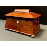 A Victorian Rosewood sarcophagus tea caddy, twin lidded removable compartments, mixing bowl