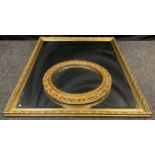 A large contemporary looking glass / wall mirror, gilt frame, 99cm x 128cm; another circular looking