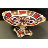 A Royal Crown Derby 1128 Imari oval comport, shaped top, acorn pierced end tips, printed marks,