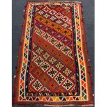 A South-West Persian Qashgai Kilim rug / carpet, knotted with stylised geometric motifs in vibrant