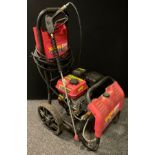 Tools- Work zone portable pressure washer, two stroke engine powered.