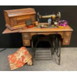 A Jones Medium CS ‘type 6’ treadle sewing machine, No. 25033, c.1901, with haberdashery supplies,