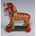 An Indian polychrome softwood and gesso pull-along toy, as a dog, 21cm high