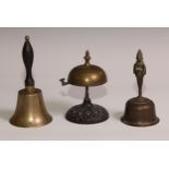 A 19th century cast iron and brass desk or table bell, the base in relief with palmettes and