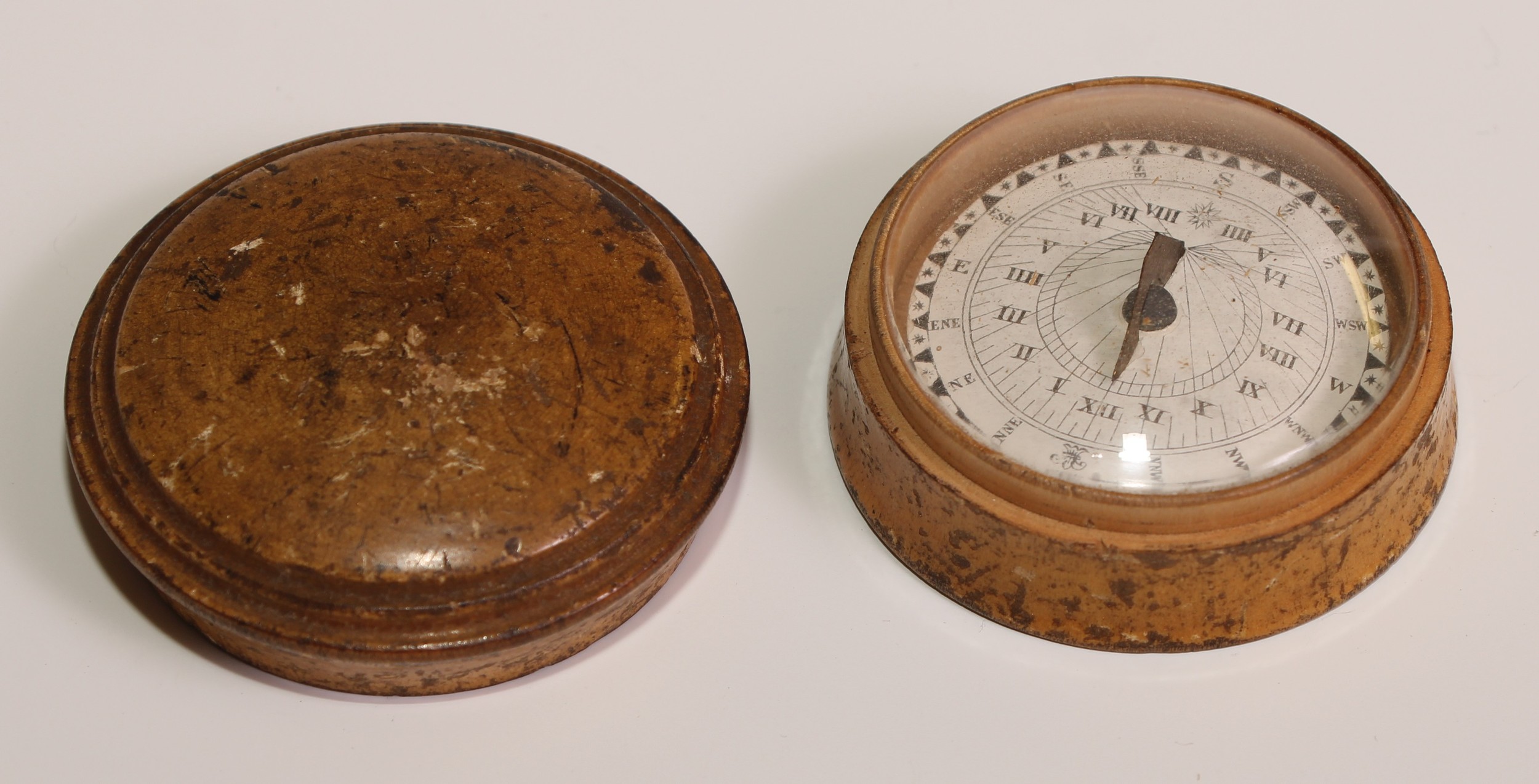 A 19th century boxwood travelling pocket compass, domed push-fitting cover enclosing a gimbal