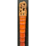 A Chinese bamboo walking stick, the pommel carved in the Cantonese manner with figures amongst