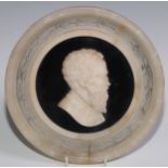 A Grand Tour alabaster portrait plaque, 22cm diam, c.1870