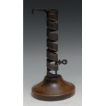 A 19th century iron and softwood spiral candlestick, 19cm high