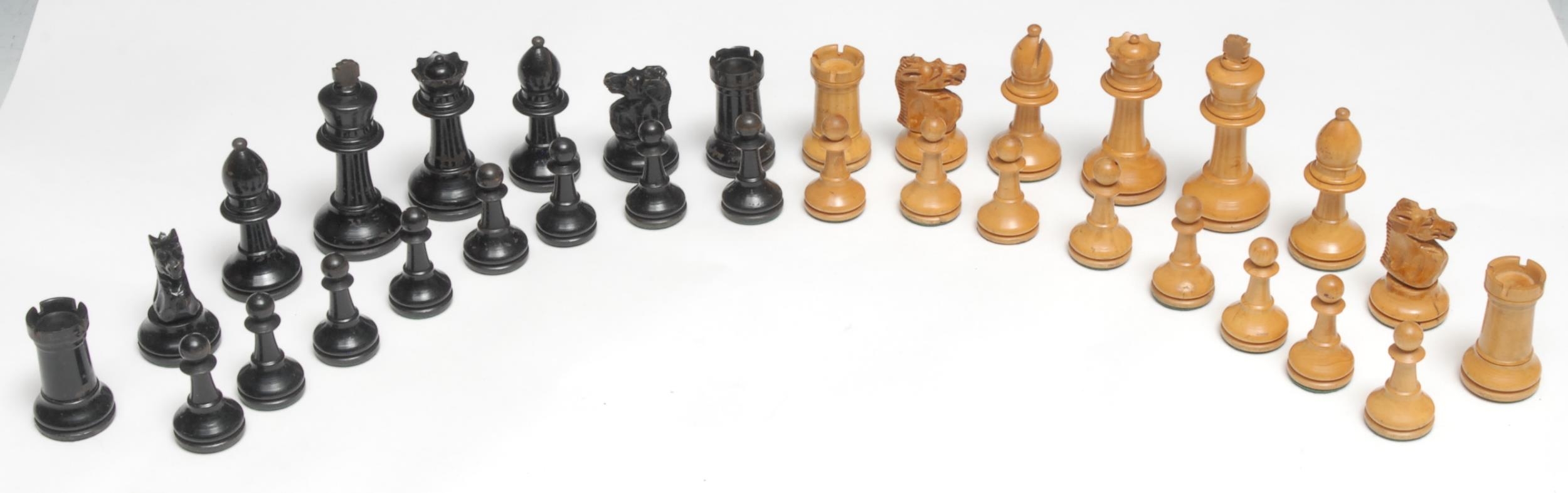 A boxwood and ebonised Staunton pattern chess set, weighted bases, the Kings 7.5cm high