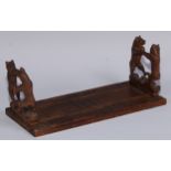 A Black Forest novelty book slide, each folding end support carved with dancing bears, 31cm wide,