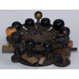 Seals - a 19th century cast iron ten-section revolving desk seal stand, brass ball finial, 17cm