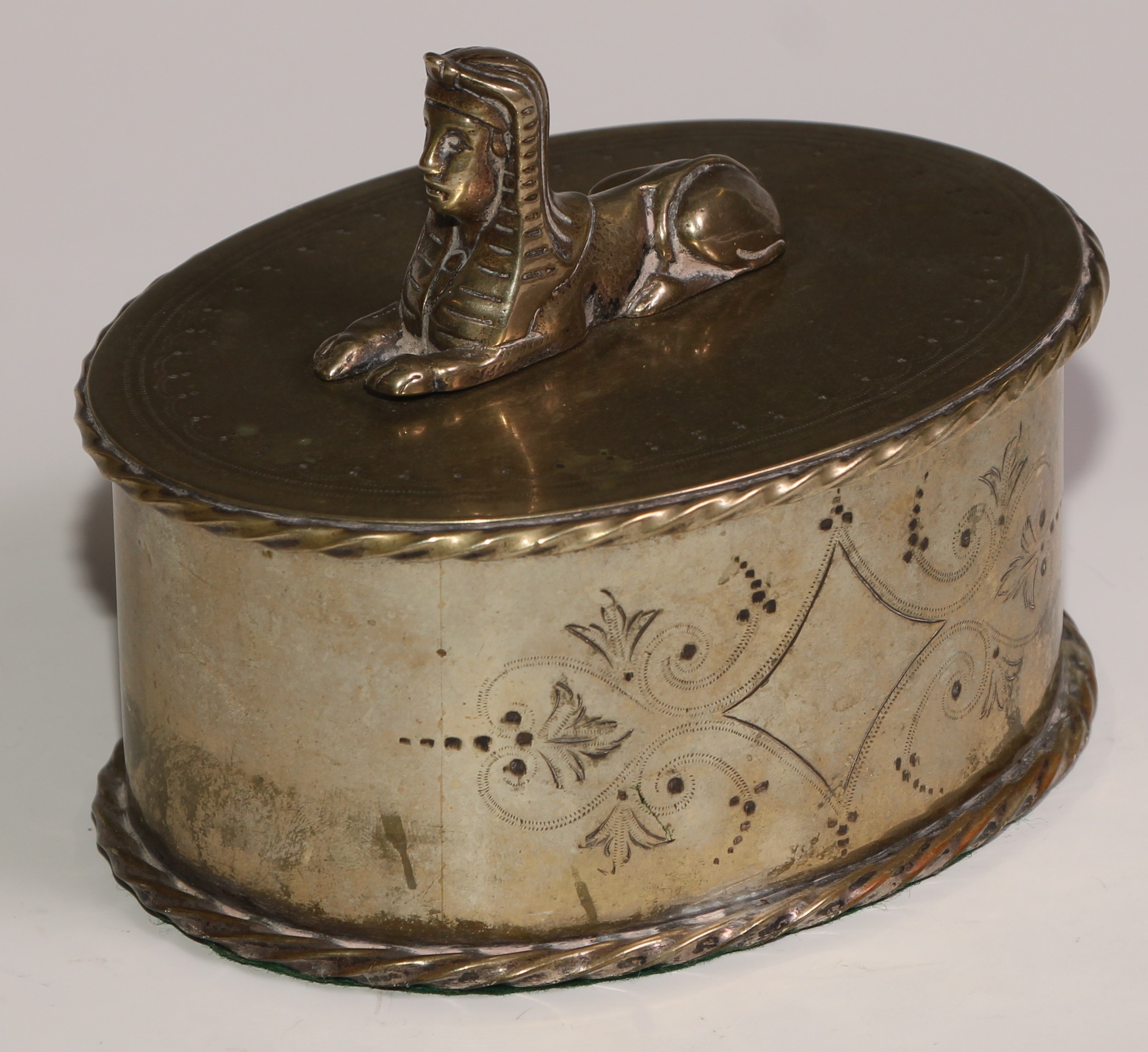 A Victorian Egyptian Revival silver plated oval box and cover, bright-cut engraved and surmounted by - Image 2 of 5