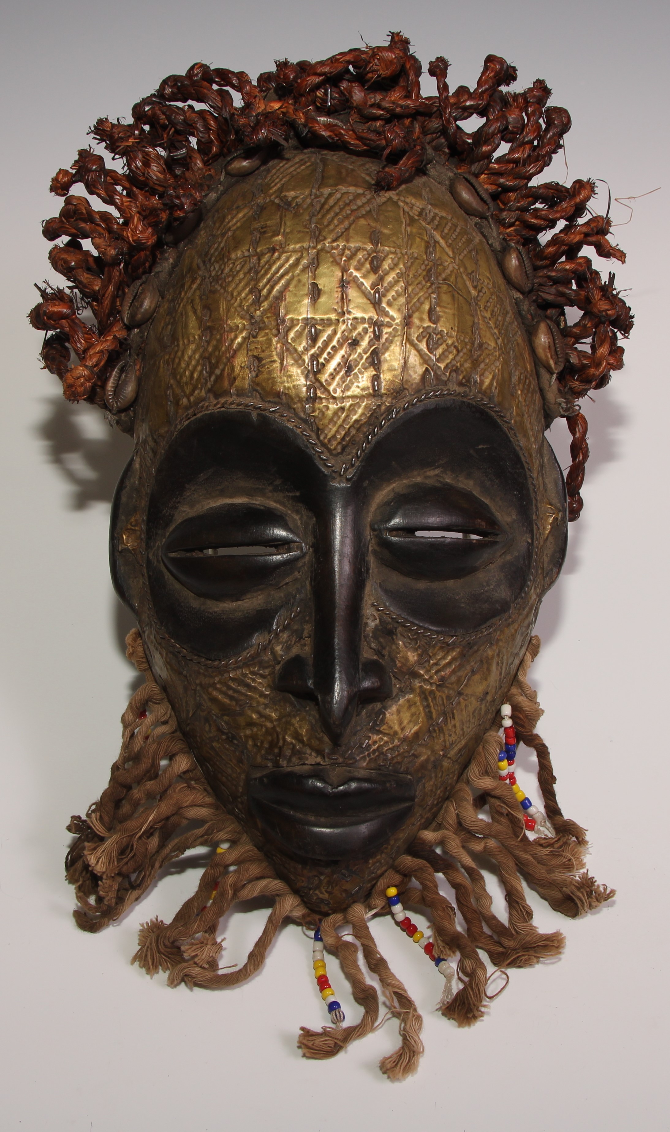 Decorative Tribal Art and the Eclectic Interior - a West African mask, stylised eliptical