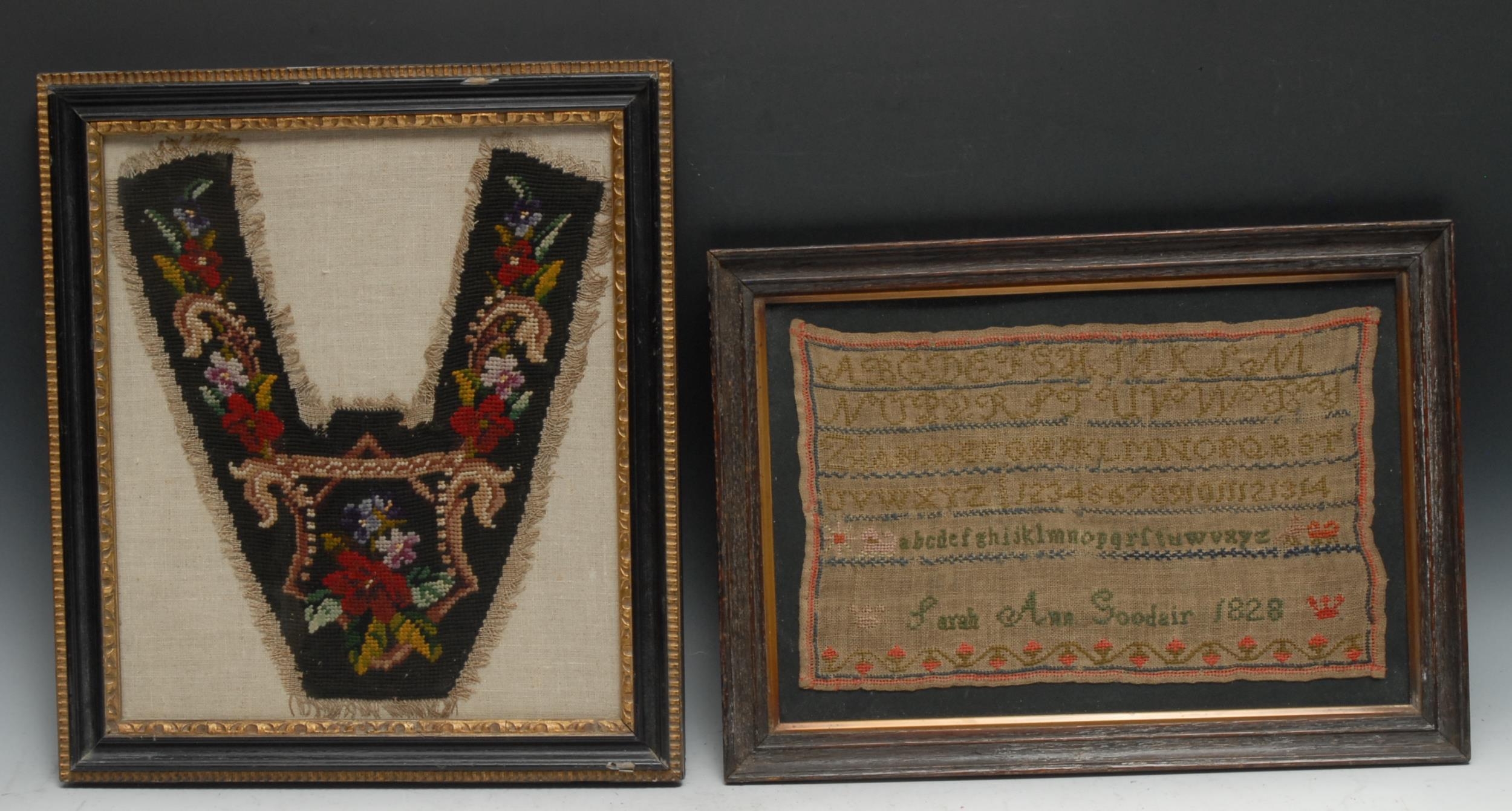 A George IV needlework sampler, Sarah Ann Goodair 1828, worked in coloured wools with alphabet and