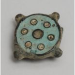 Antiquities - a Roman stud plate brooch, decorated in enamel, pierced fitting for fastening, 3cm