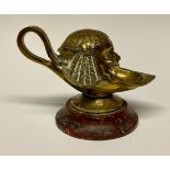 A 19th century Grand Tour gilt bronze inkwell, cast after the Antique, rosso antico marble base,