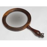 A 19th century lignum vitae connoisseur's lens, circular magnifying glass, turned handle with