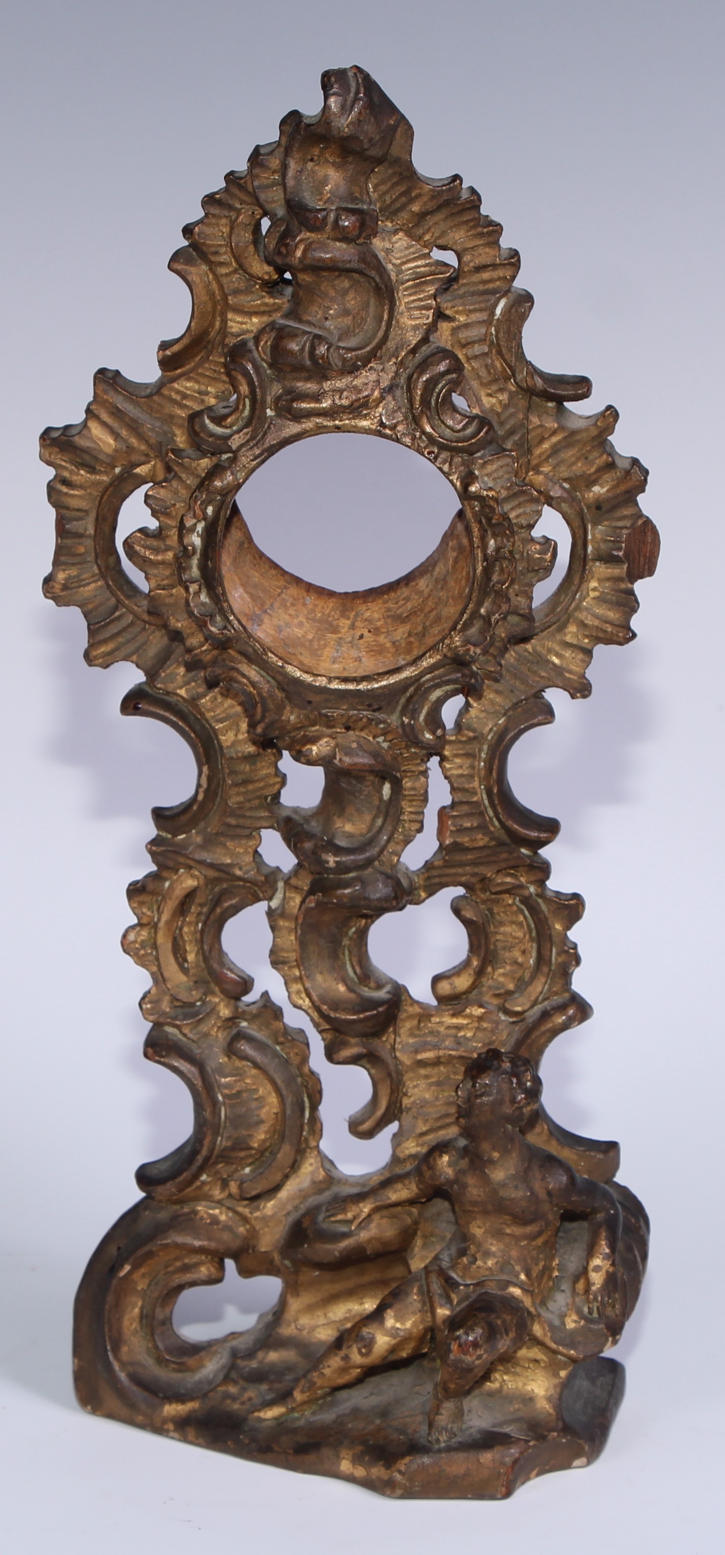 A sculptural 19th century gilt wood pocket watch stand, carved in the Rococo taste with a scantily