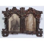 A Black Forest easel double photograph frame, carved with fruiting oak, 20.5cm wide, c.1900