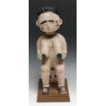 Tribal Art - an Ashanti figure, female, carved seated on a stool, collector's display plinth, 38.5cm