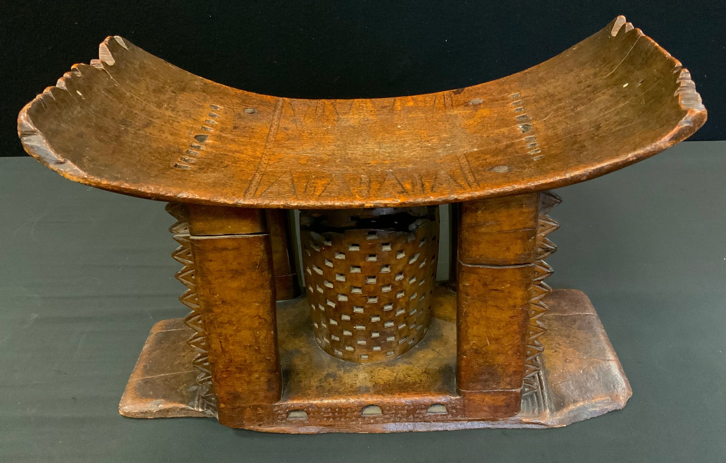 Tribal Art - a 19th century Ashanti stool or seat, arched rectangular seat with four carved supports - Image 4 of 4