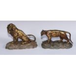 Aubert (French), a pair of gilt bronzes, lion and lioness, each snarling, rocky marble bases,