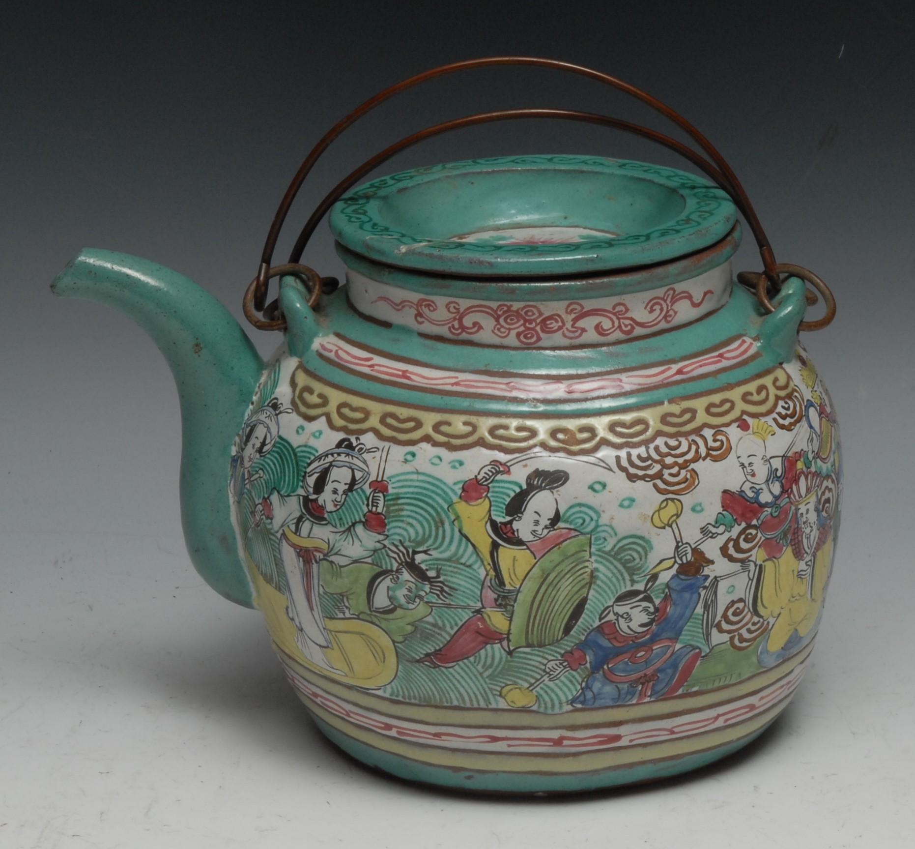 A Chinese Yixing type wine pot, brightly decorated in polychrome enamels with figures, 21cm long - Image 2 of 2