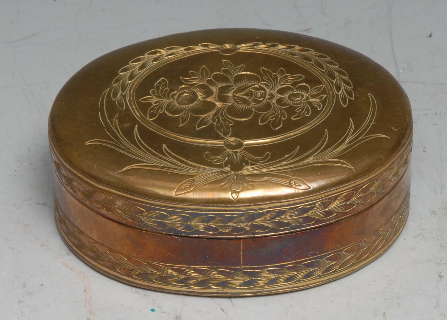 A late 18th century gilt copper oval table snuff box, engraved with flowers and palm fronds, stand-