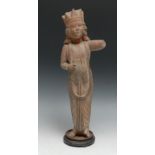 An Indian terracotta devotional figure, possibly of the Virgin Mary, crowned as Queen of Heaven,