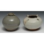 A Chinese celadon wine jar, of Archaic form, four lug handles, 16cm diam; another (2)