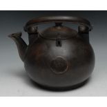 A Japanese bronze kettle, 24.5cm over raised handle, 19th century