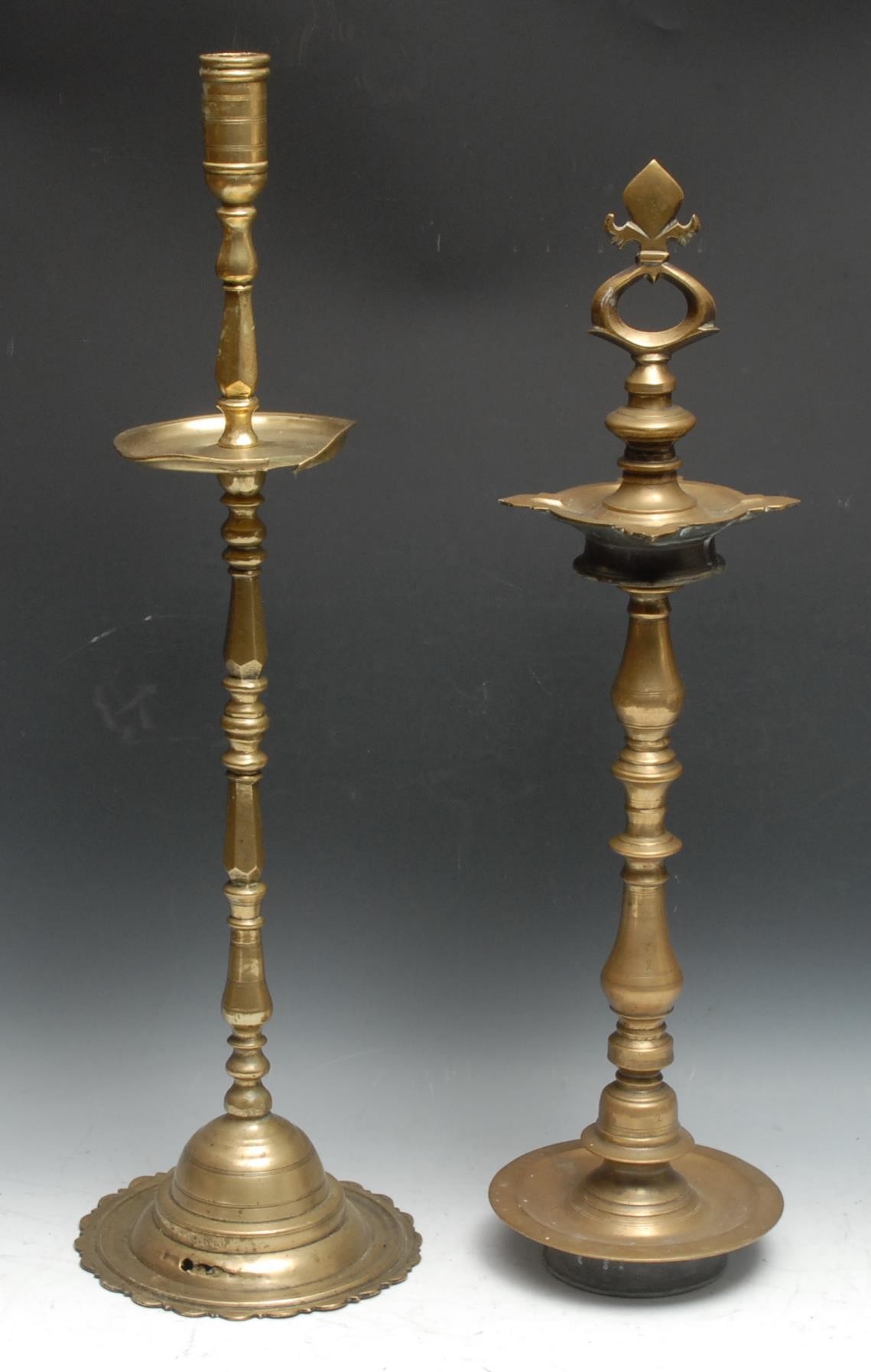 A large Indian brass candlestick, cylindrical sconce above a broad drip pan, domed lotus shaped - Image 2 of 2