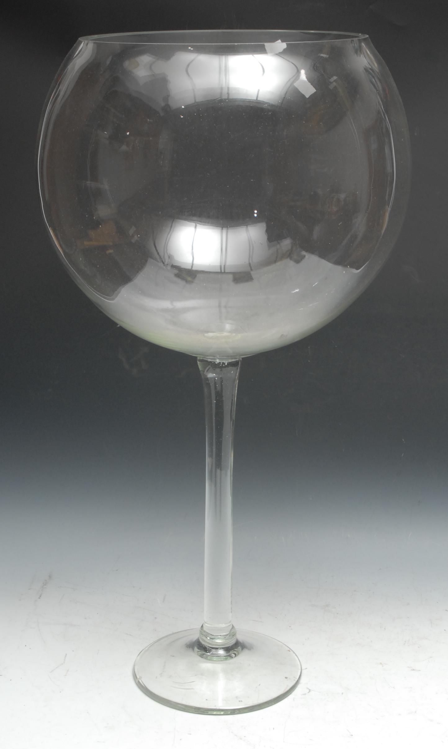 An unusual oversized wine glass, possibly an advertising shop display sign or bar window model, 73cm