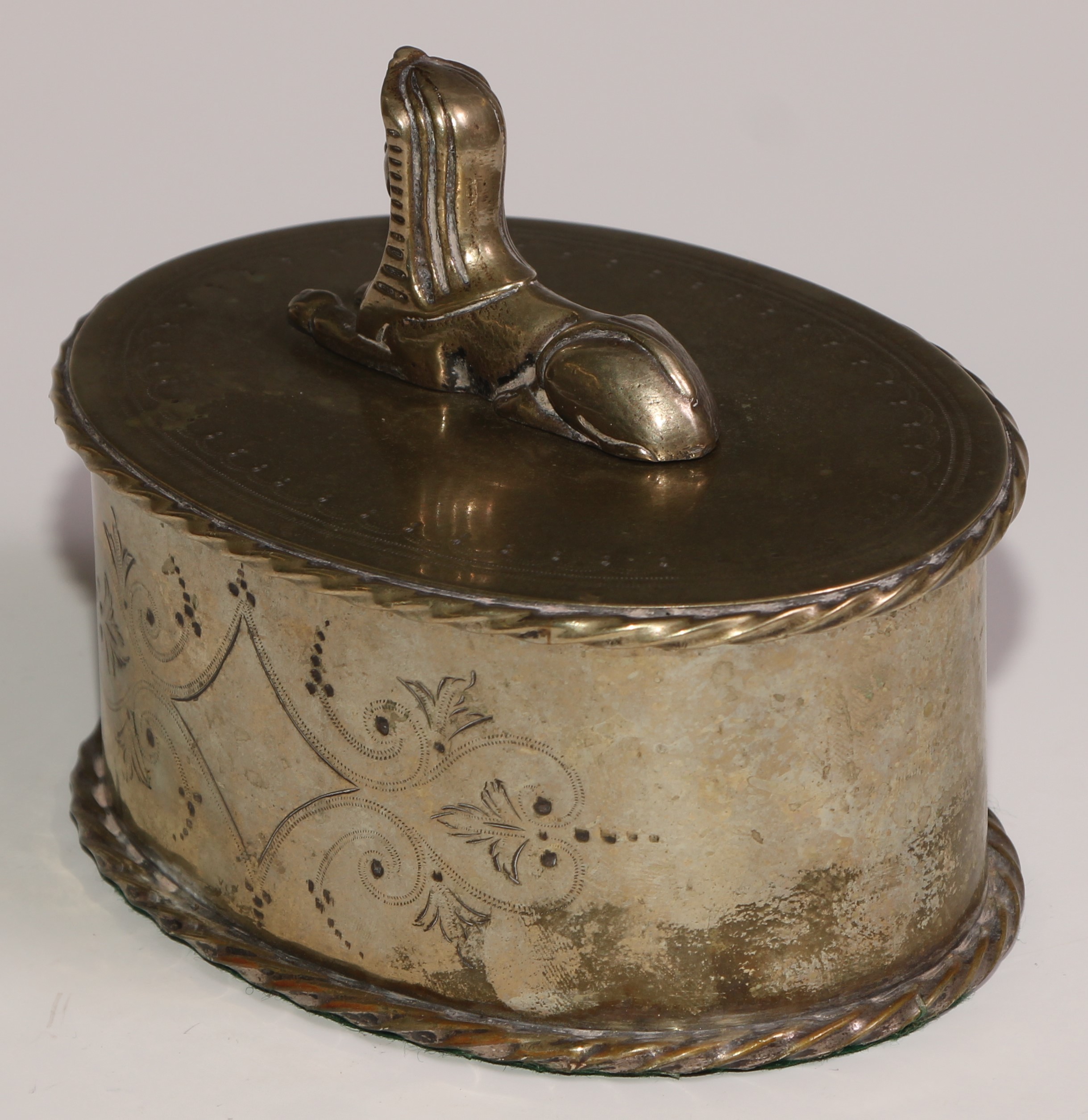 A Victorian Egyptian Revival silver plated oval box and cover, bright-cut engraved and surmounted by - Image 4 of 5