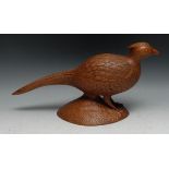 Folk Art - a mahogany carving, of a game bird, 42cm long