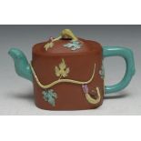 A Chinese Yixing rounded rectangular wine pot moulded and picked out in coloured enamels with