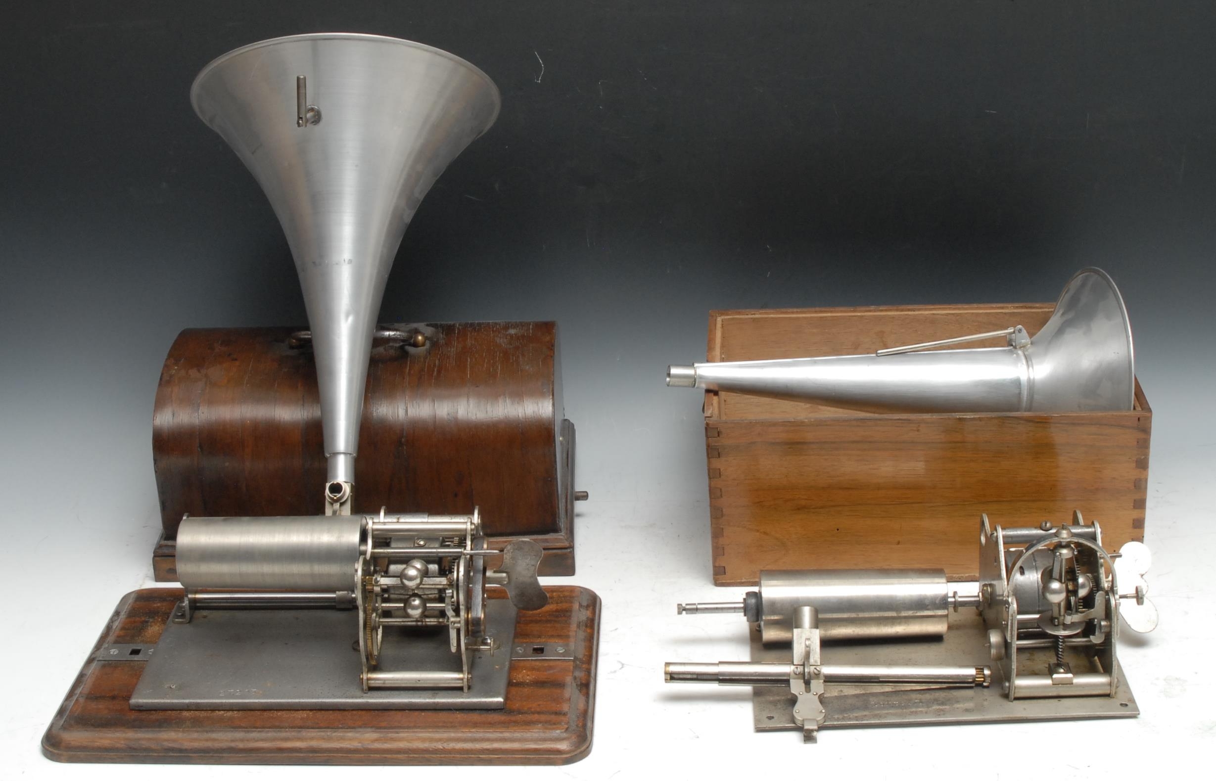 An early 20th century cylinder phonograph, serial no. 27203, domed cover, 32cm wide; another; two