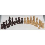 A boxwood and hardwood Staunton pattern chess set, by House of Chess, the Kings 9.5cm high, green