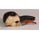 An early 20th century meerschaum novelty pipe, as the head of a bearded gentleman wearing a fez,