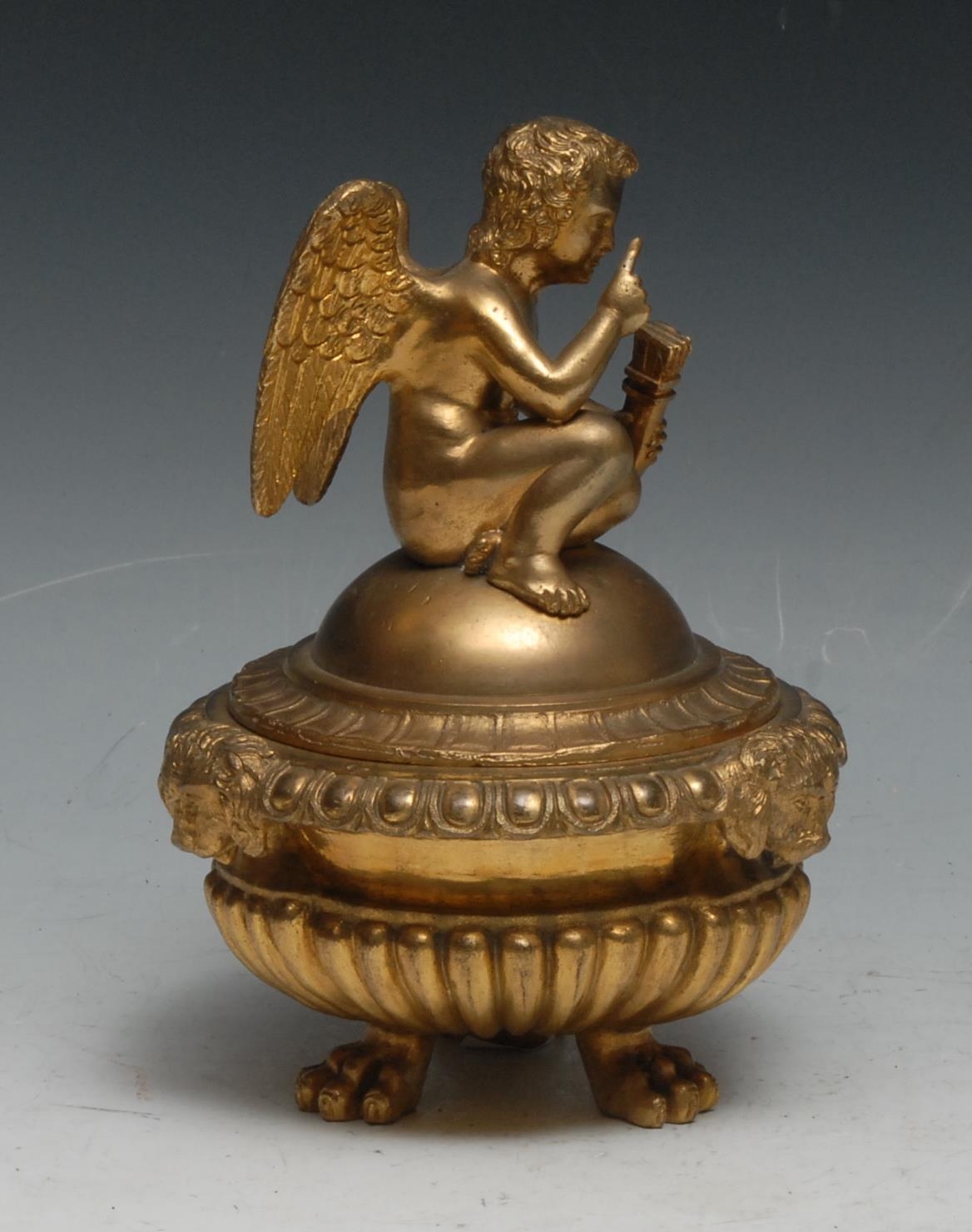 A Regency design gilt bronze half-fluted tripod inkwell, domed cover crested by a putto, egg-and- - Image 2 of 2