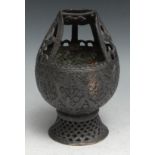 An Indian dark patinated copper alloy lamp or censer, chased in the Kashmiri or Persian taste,