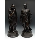 A pair of Grecian Revival brown patinated spelter library figures, each circular base with a