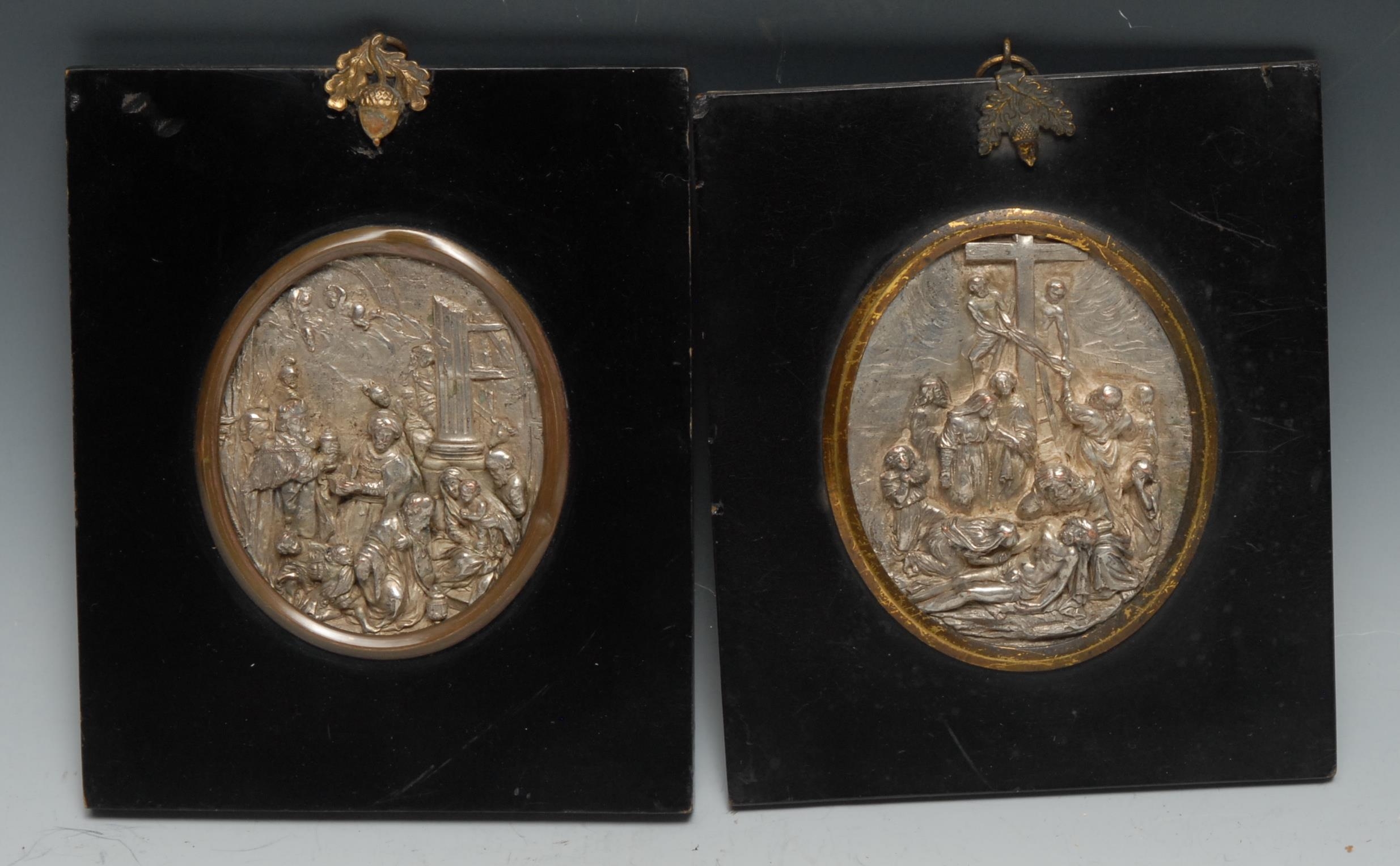 A pair of 19th century electrotype oval panels, in relief after the Old Master with the Adoration of