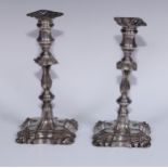 A pair of Old Sheffield Plate table candlesticks, knopped pillars, shells to angles, 23.5cm high,