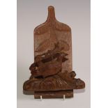 A Black Forest novelty wall hanging letter rack, carved with a game bird, 21.5cm long, c.1900 (re-